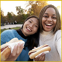 women with hotdogs
