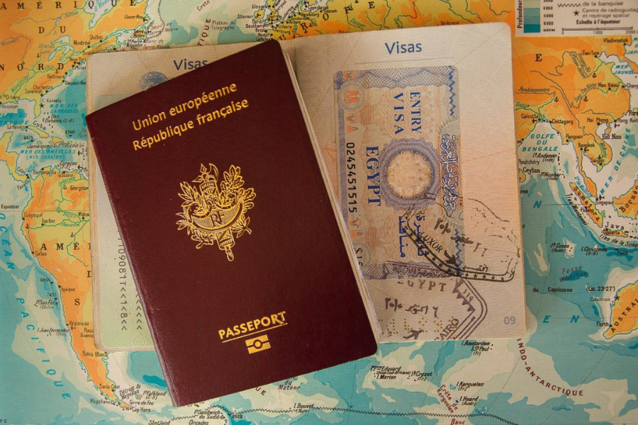 Two passports sit on a map