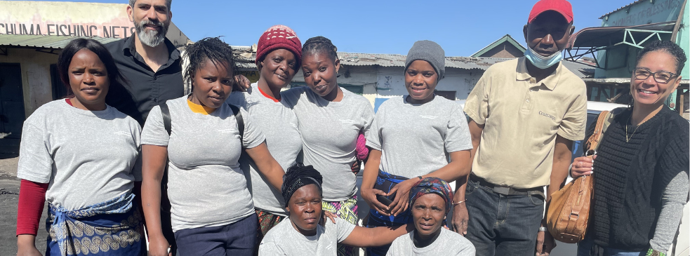 A group poses for a photo outside in Zambia