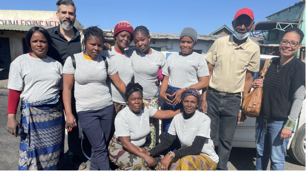 A group of people pose outside in Zambia