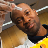 A scientist examines a test tube