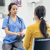 A doctor consults with a female patient