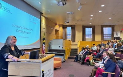 UMSSW Dean Judy Postmus, PhD, ACSW, delivers the 2025 State of the School address.