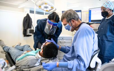 Ramsay Koury, DDS, supervises students at the Shady Grove Mission of Mercy.