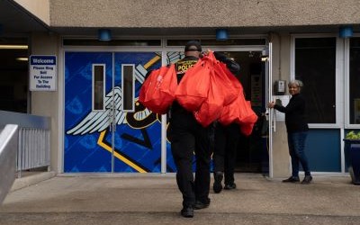 UMB Police and Public Safety deliver turkeys to a West Baltimore elementary school during the annual Thanksgiving Drive.