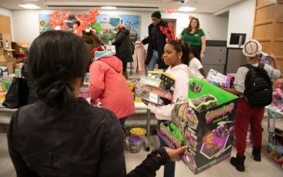 Shoppers look for gifts at the Christmas Store, which was held Dec. 13-14 at the UMB Community Engagement Center.