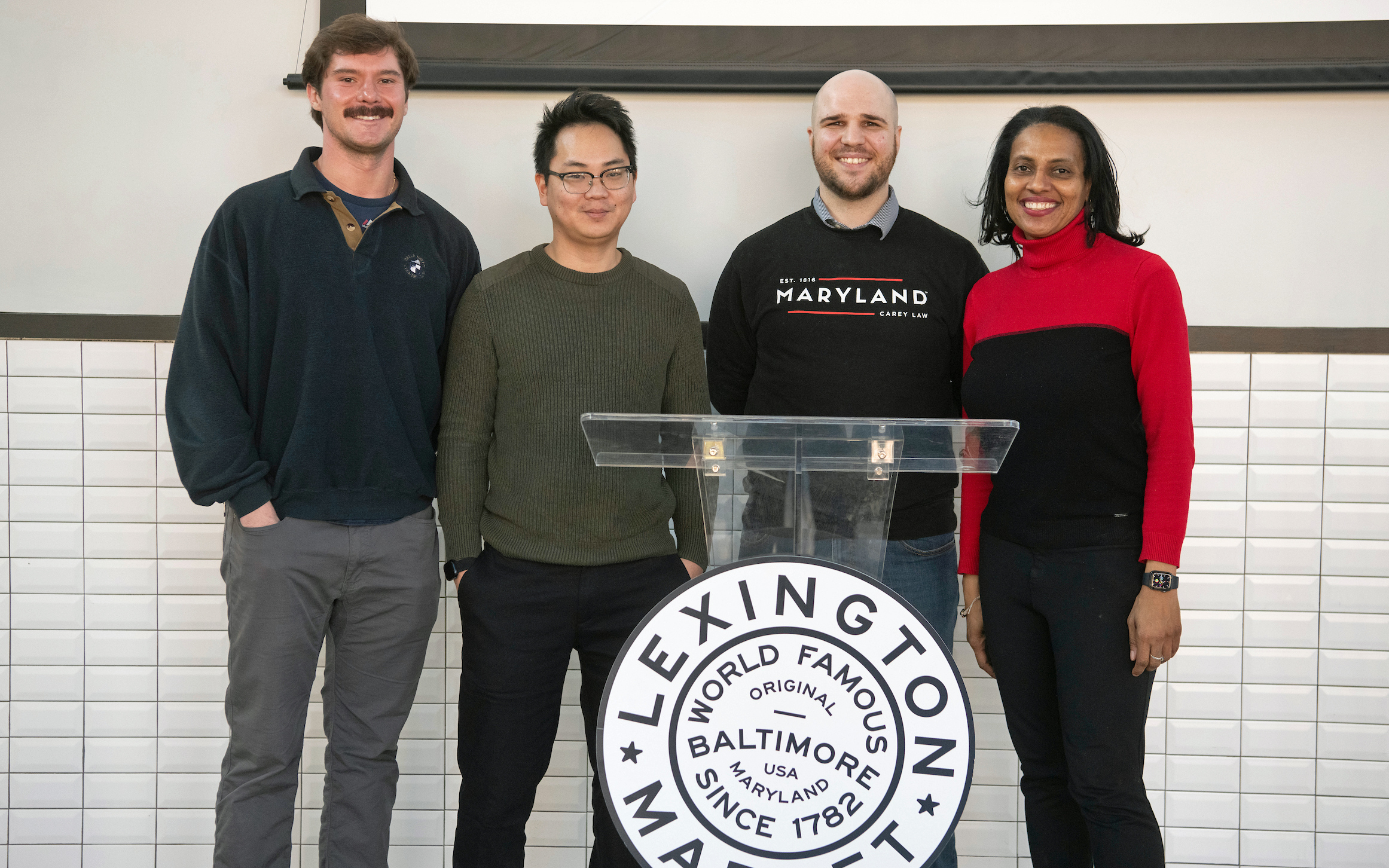 (From L-R) Law students Robert Ayers, Dustin Koller, and Colin Forrest and Beverly Winstead, JD, director, Low Income Taxpayer Clinic.