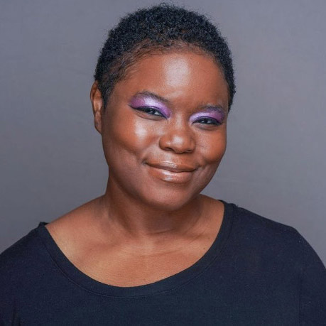 Smiling woman on a gray background